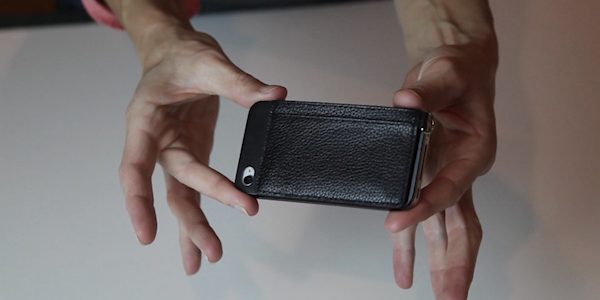 hands holding fone wallet